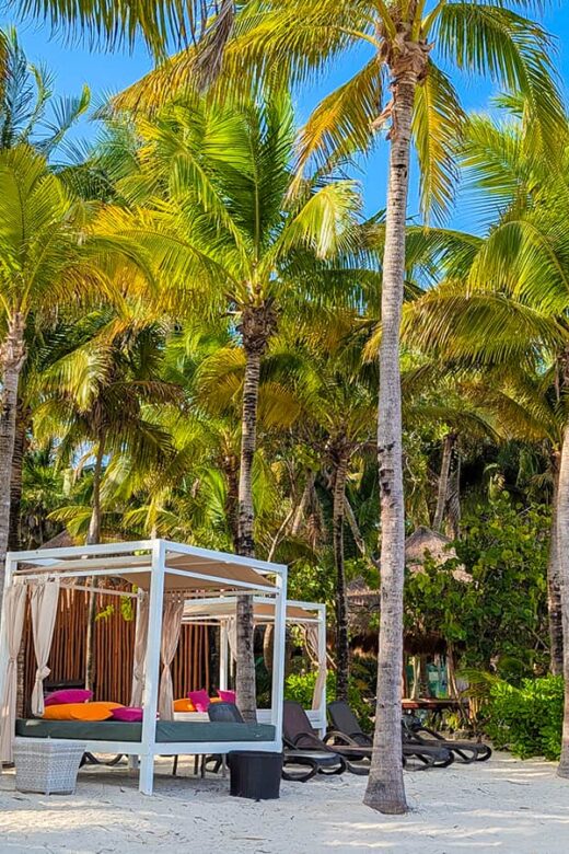 beach cabanas, palm beaches, and lush landscaping in Riviera Maya