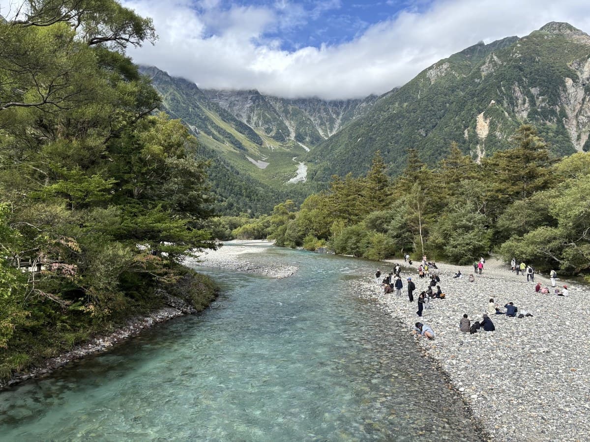 Clear Azusa River in Kamikochi with the Japanese Alps in the background
