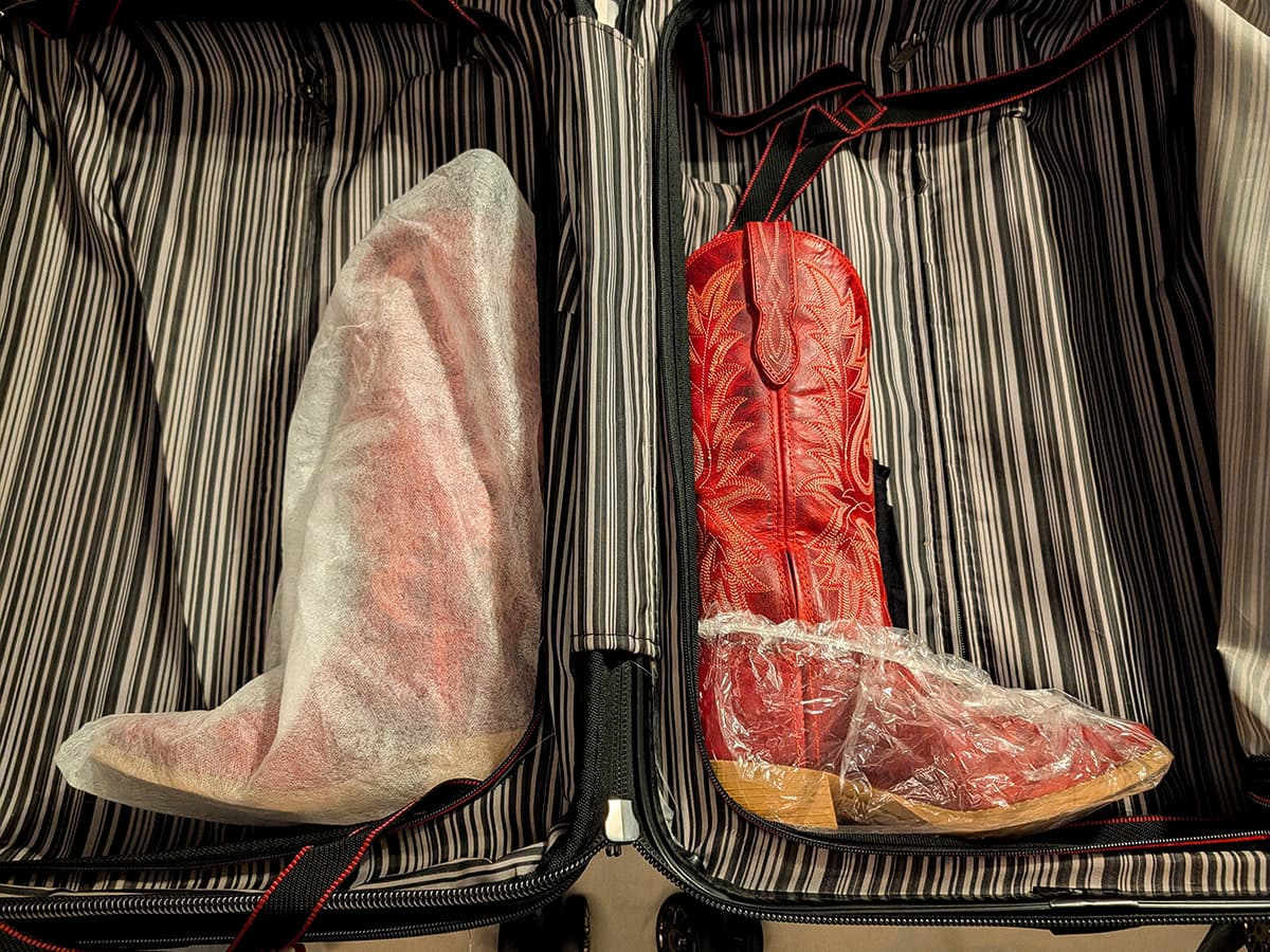 Cover cowboy boots before packing