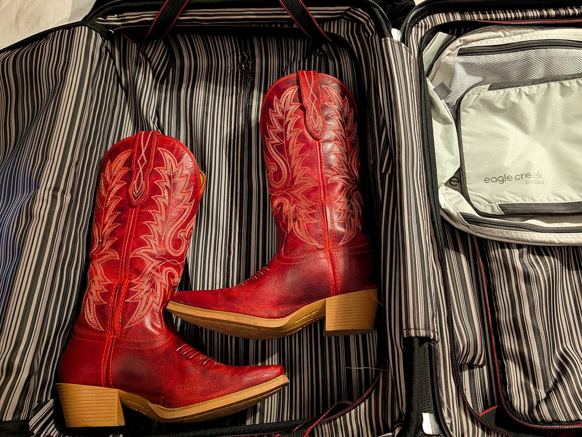 cowboy boots in a suitcase