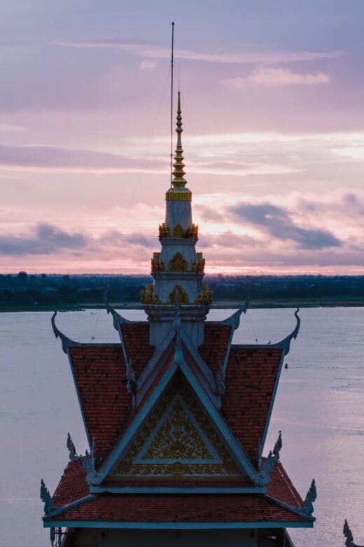 aerial view of Cambodian temple by the Mekong at sunset