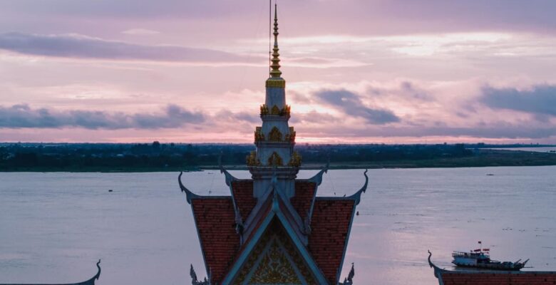 aerial view of Cambodian temple by the Mekong at sunset